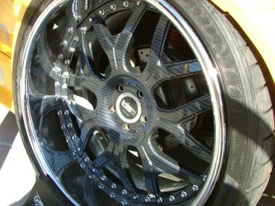 our Carbon Fiber treatment to a used and abused rim
we striped it and polished the ring and put Gold Carbon on this rim,its the rave in La.
