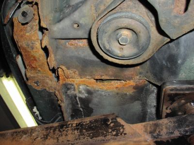 Looking Up at Floor
This is looking up from underneath the car.  You can see a hole right through to the interior.
Keywords: rust weld welding