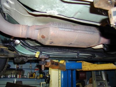 Old converter, original OEM installation
This shows what the original converter looked like as it was installed.  I changed this because all the insides were loose and rattled around.  It didn't hurt the performance of the car, but it drove me crazy.  The car sounded like a piece of junk.
Keywords: converter catalytic exhaust random