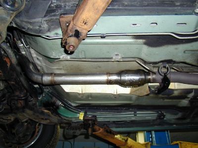 New Converter Installed
This is how it looks in the finished installation.  Not much of a converter, is it?  Supposedly it is fully legal, according to the company.  It passes emissions no problem.  But I think if someone actually looked at this during an inspection, I could run into trouble.  I lost low end torque after this installation, but gained more power at higher rpms.  I would have gone with a GM part but the price was ludicrous.
Keywords: converter catalytic exhaust random