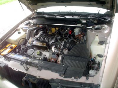 Engine Compartment
This was the worst of the deal. It's also why this vehicle was slated for scrap.
The original K motor died. So someone replaced it with an L motor. They didn't think to keep the original harness. So none of the dash gauges worked! I consulted the schematics, added necessary wires to the harness, and now all of the gauges work.
Keywords: Motor