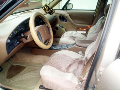 Front Seats
The passenger seat seems OK. And the 10 way seats still work. But the drivers seat is ripped badly. I am looking into options to rectify the problem. Until then, these cheap seat covers will have to do.
Keywords: Cheap