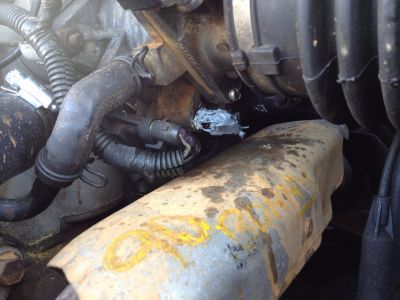 Throttle body coolant lines
Lines are covered in gray calk, but it shows location.
